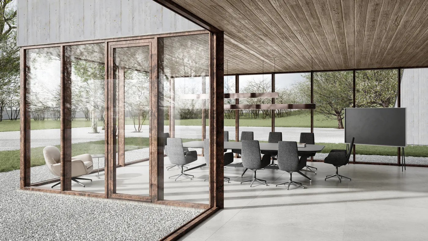 Aluminium-Glasfronten mit Rostoptik-Oberfläche an einem modernen Pavillon mit Blick ins Grüne